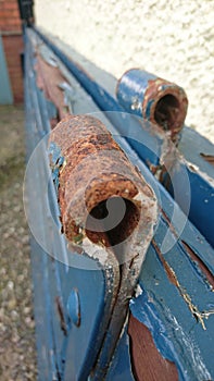 Rusty hinge blue gate peeling paint door