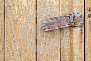 Rusty hinge Lock on old wooden door