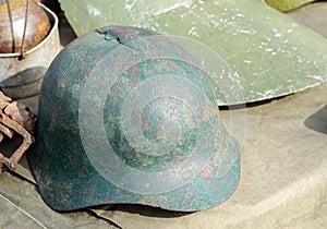 Rusty and holed military helmet