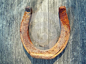 Rusty Horseshoe on Wooden Barrel