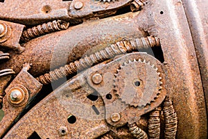 rusty industrial cogwheel and other scratched parts of old machine