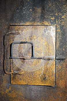 rusty iron door of a coal furnace