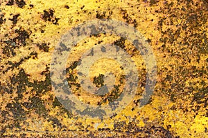 Rusty iron metal surface with yellow paint. Texture and background