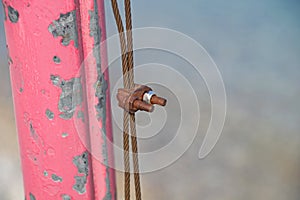 The rusty iron pulley with blue sky background .