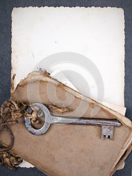 Rusty key, old book andempty photography