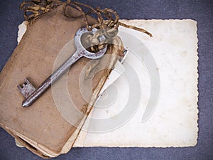 Rusty key, old book andempty photography