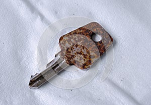 Rusty key on tissue paper