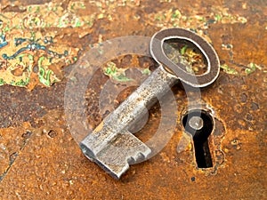 Rusty keyhole with key