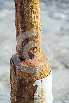 Rusty lamppost Mykonos Town Harbour Greece