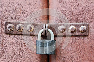 Rusty lock on garage gate