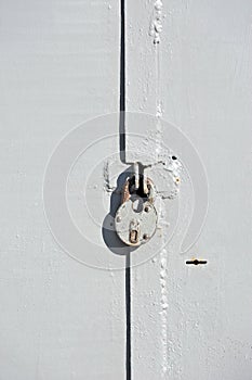 Rusty lock on garage gate