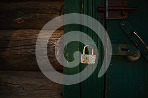 Rusty lock on the old wooden door.