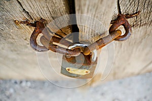 Rusty lock and Wooden background