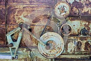 Rusty machine gears, pulleys, and belt