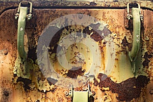 Rusty manhole cover. Fasteners on military equipment. Old door handles