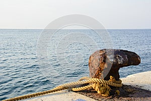 Rusty marine dock bollard
