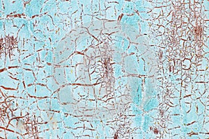 Rusty metal abstract background. Texture of an old blue grunge metal plate with cracked paint.