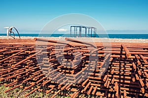 Rusty Metal armature net for building construction on the sunny beach