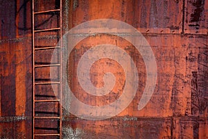 Rusty metal background with a ladder