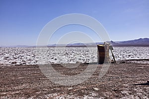 Rusty Metal Barrel and Wooden Sing in the Atacama Desert