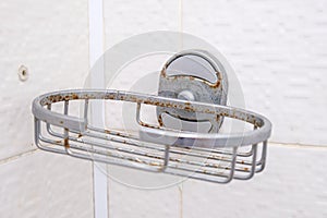 Rusty metal bath accessories, shower set damaged because of high humidity