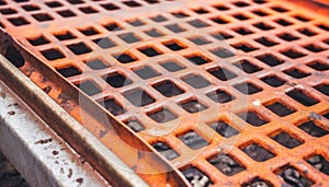 Rusty metal car on metal grate in rainy construction industry generated by AI