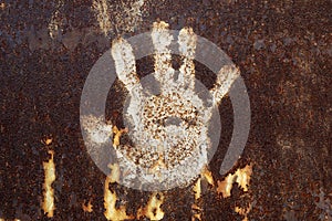 Rusty metal with handprint