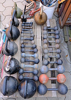 rusty metal on kettlebells, dumbbells and canters. Antique items for weighing products. For bodybuilding, for sports at home