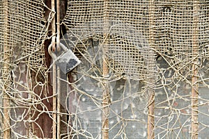 Rusty metal net and rusty padlock 6
