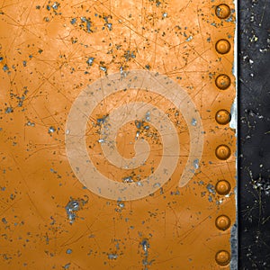 Rusty metal strip with rivets on the left against on black metal background 3d