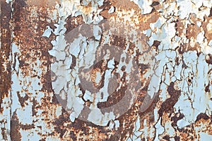 Rusty metal surface. Old peeling paint on an iron surface. Iron wall.