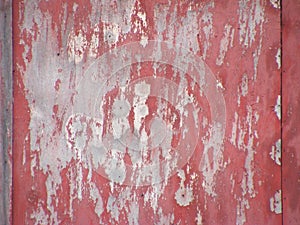 Rusty metal surface with rich and various texture painted in red grenadine