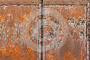 Rusty metal surface with rivets and joints