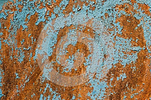 Rusty metal turquoise and red color texture background. Oxidated metal surface. Old vintage painted steel plate