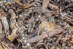 Rusty metal waste lying unsorted in a heap