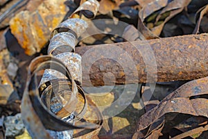 Rusty metal waste lying unsorted in a heap