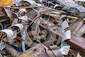 Rusty metal waste lying unsorted in a heap