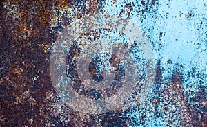 Rusty metallic texture. Oxidation of the metal. Grunge, steampunk, rock, vintage. Iron background, brown, red and blue