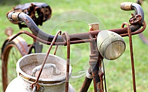 Rusty milkman's bike with aluminium drum and lights photo