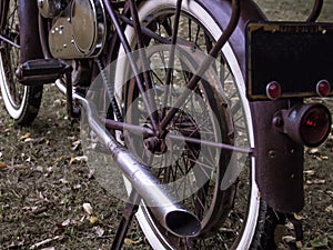 Rusty motorized retrofit bicycle with white wall tires
