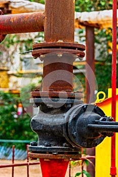 Rusty natural gas pipeline with bolts and nuts