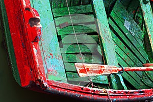 Rusty oars in an old wooden boat