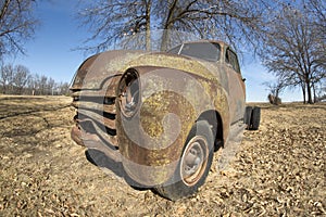 Rusty old aboned pickup truck