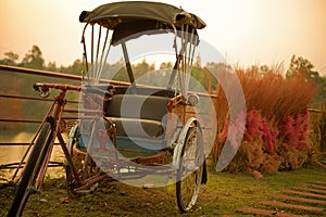 Rusty Old Antique Tricycle Outdoor Stand For Restaurant And Hotel Decoration.