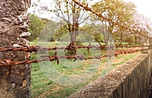 Rusty old barbed wire fence on Wall