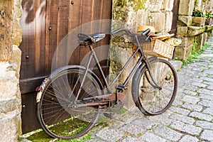 Rusty old bicycle in doorway