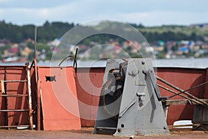 Rusty old boat winch on the dock