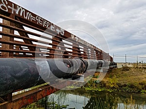 Rusty old bridge over a creek