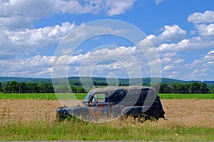 Rusty Old Car in Farm Field