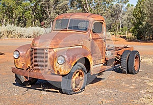 A rusty old classic truck on display